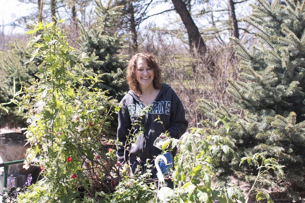 Potterville resident Tina Walker smiles outside after she purchased new plants to garden at her home at the Spring Show and Plant Sale on April 23, 2016 at the Plant and Soil Sciences Building.  The Spring Show and Plant Sale is the MSU Horticulture club's biggest event of the year.