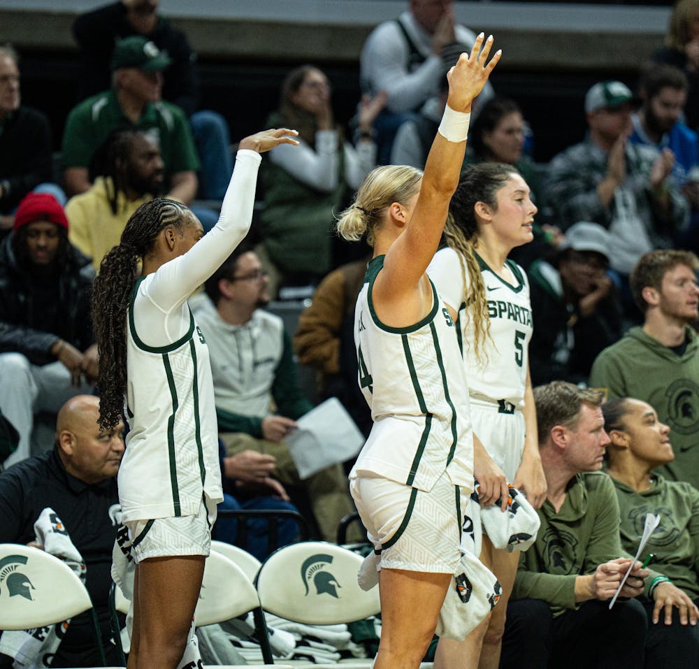 MSU junior guard, Rashunda Jones (1) and senior guard Theryn Hallock (4) celebrate a three-point shot during the MSU versus Eastern Michigan Women's Basketball game at Michigan State University's Breslin Center on Sunday, Nov. 9, 2025