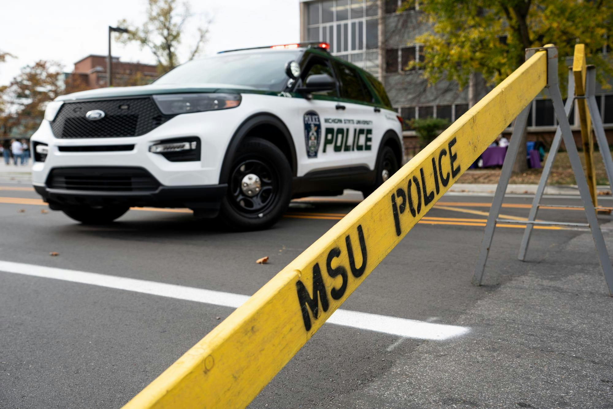 <p>A Michigan State University Police patrol cruiser blocks off Farm Lane, north of the Red Cedar River on Oct. 29, 2024. Emergency services cordoned and evacuated the area surrounding the intersection of Farm Lane and North Shaw Lane.</p>