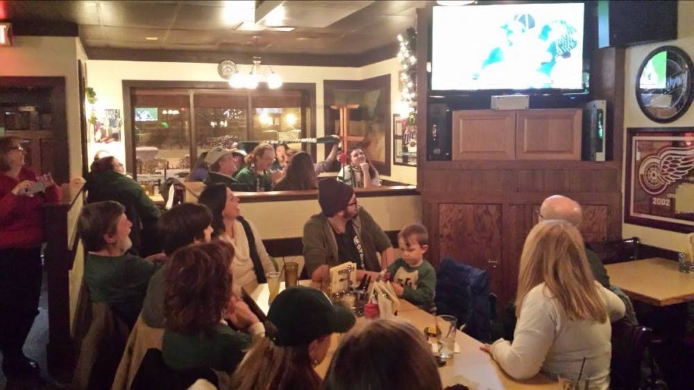 	<p>Patrons take in the Rose Bowl game at the Peanut Barrel in East Lansing on Wednesday, January 1.</p>