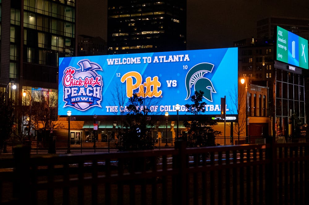 <p>A billboard welcomes fans to Atlanta, Georgia, home of the Chick-fil-A Peach Bowl, on Dec. 29, 2021.</p>