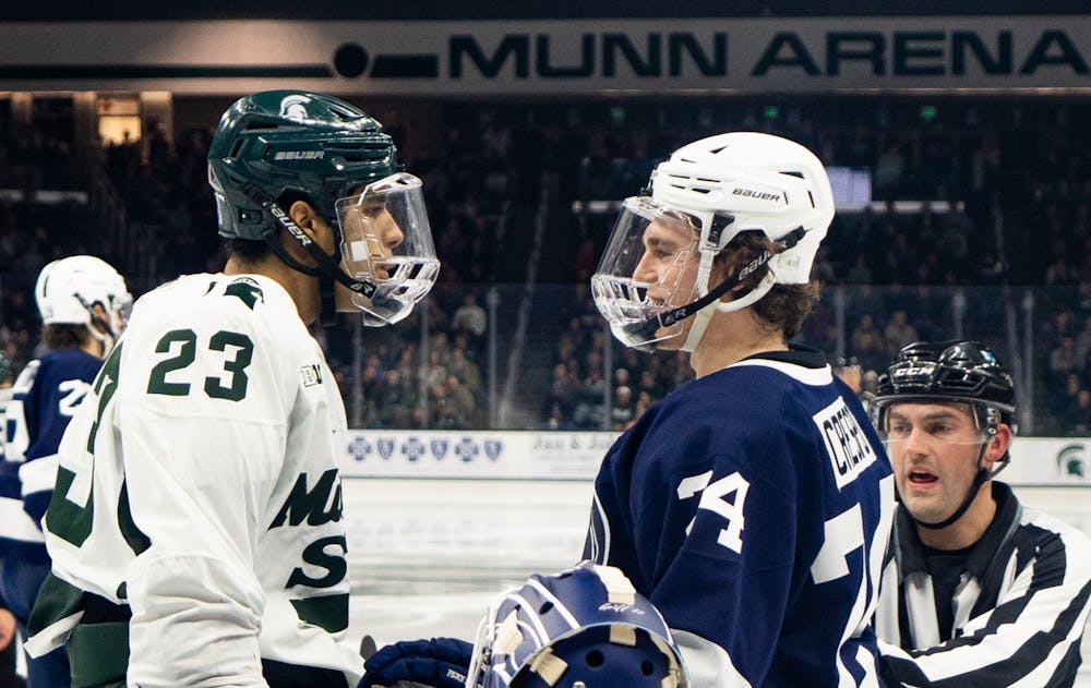 Senior forward Jagger Joshua (23) fights with a Penn State player during a game at Munn Ice Arena on Jan. 13, 2023. The Spartans defeated the Nittany Lions with a score of 3-2. 