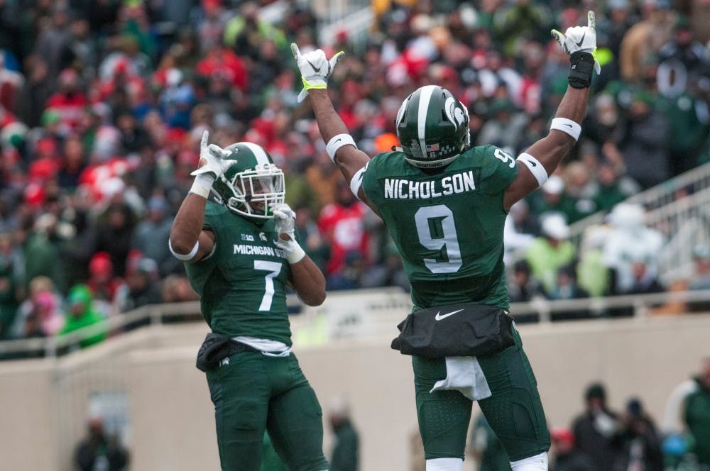 Senior defensive back Demetrious Cox (7), left, and junior safety Montae Nicholson (9) get pumped before a play during the game against Ohio State on Nov. 19, 2016 at Spartan Stadium. The Spartans were defeated by the Buckeyes, 17-16. 