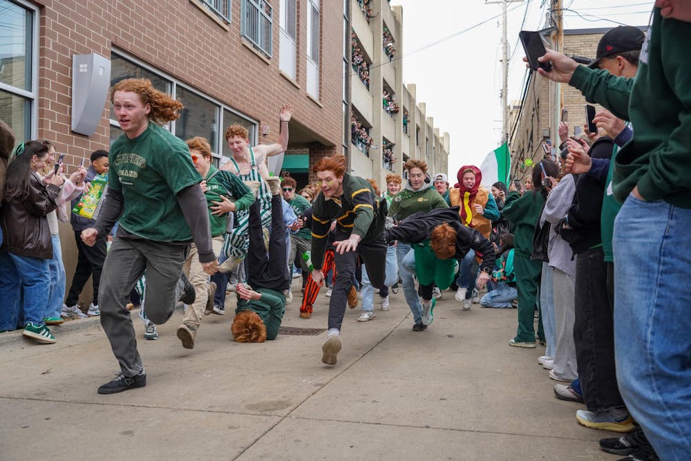Michigan State University students participate in downtown East Lansing, Mich., for the Ginger Run on Saturday, March 14, 2026.