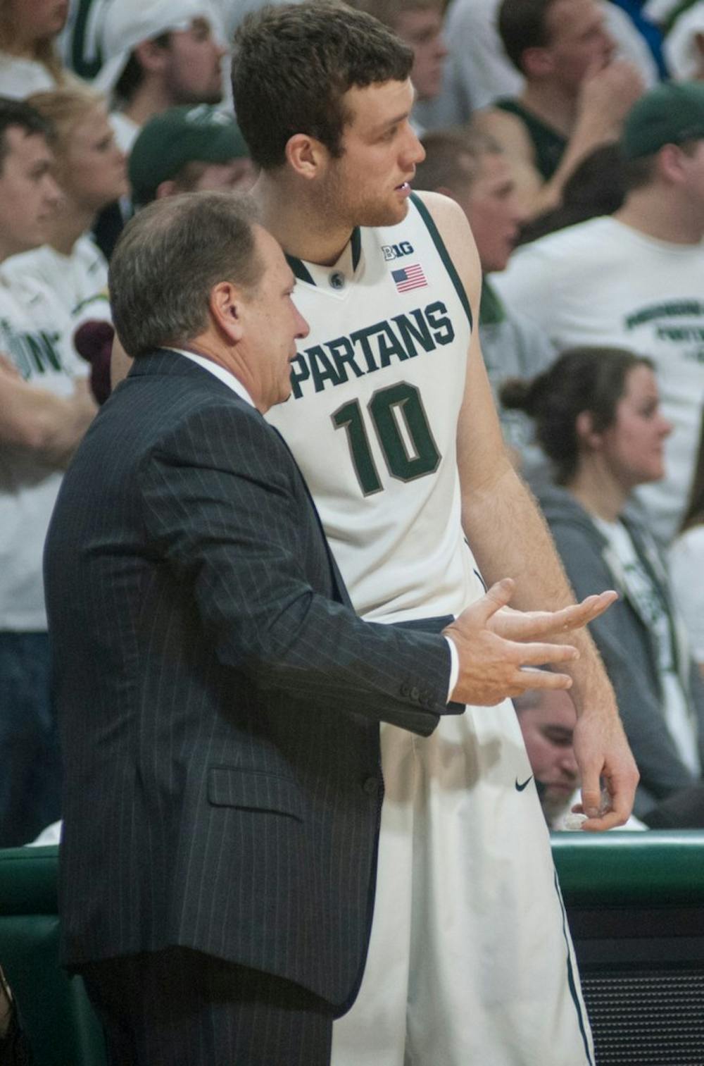 <p>Coach Tom Izzo and junior forward Matt Costello deliberate Jan. 21, 2015, during a game against Penn State at Breslin Center. The Spartans defeated the Nittany Lions, 60-66. Alice Kole/The State News</p>