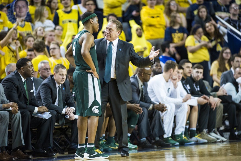 Freshman guard Cassius Winston (5) talks with head coach Tom Izzo during the men's basketball game against the University of Michigan on Feb. 7, 2017 at Crisler Arena in Ann Arbor, Mich. The Spartans trailed the Wolverines at the half, 55-29. 