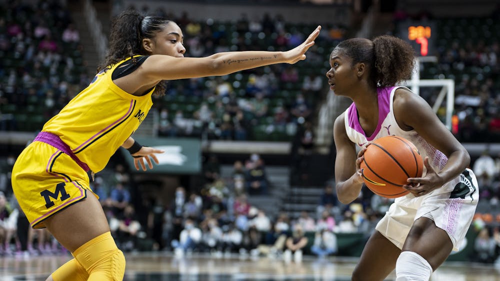 <p>Then-senior guard Nia Clouden (24) attempts to move the ball down the court during the game against Michigan on Feb. 10, 2022, at the Breslin Center. The Spartans defeated the Wolverines 63-57.</p>