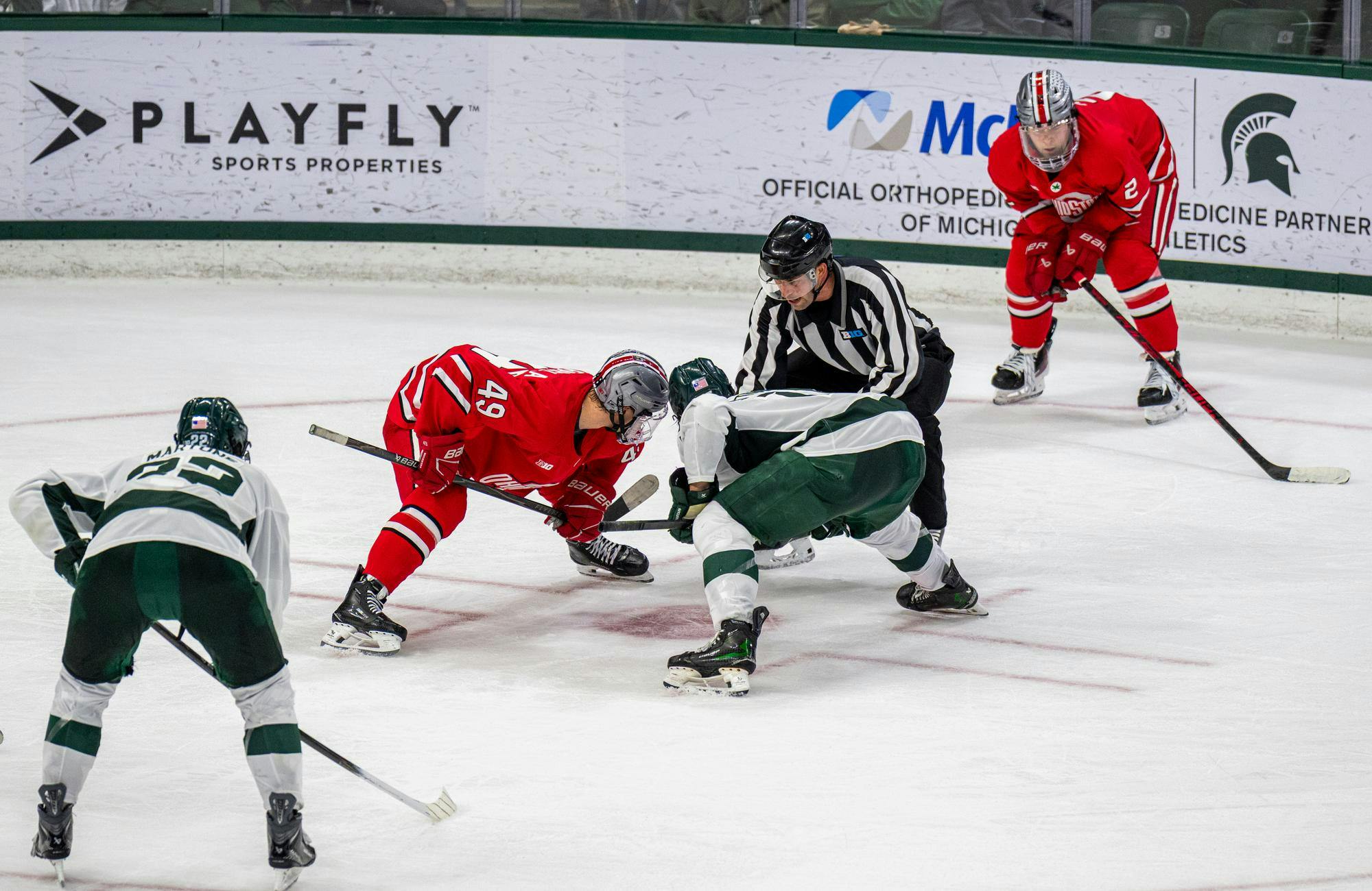 MSU Sr. F, Charlie Stramel (15), faces an Ohio State player to win the puck in Munn Ice Arena in East Lansing, MI on Feb. 28, 2026.