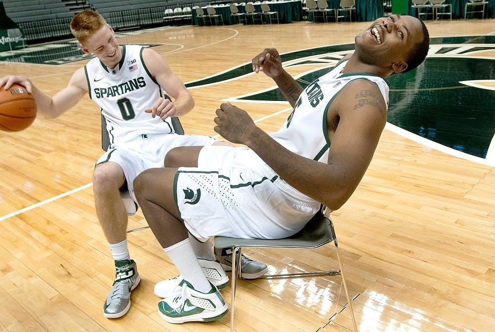 	<p>Sophomore guard Russell Byrd, left, laughs with senior center Derrick Nix on Tuesday, Oct. 9, 2012, at Breslin Center during media day. Head coach Tom Izzo announced the two were named as team captions during a speech earlier in the day. Justin Wan/The State News</p>