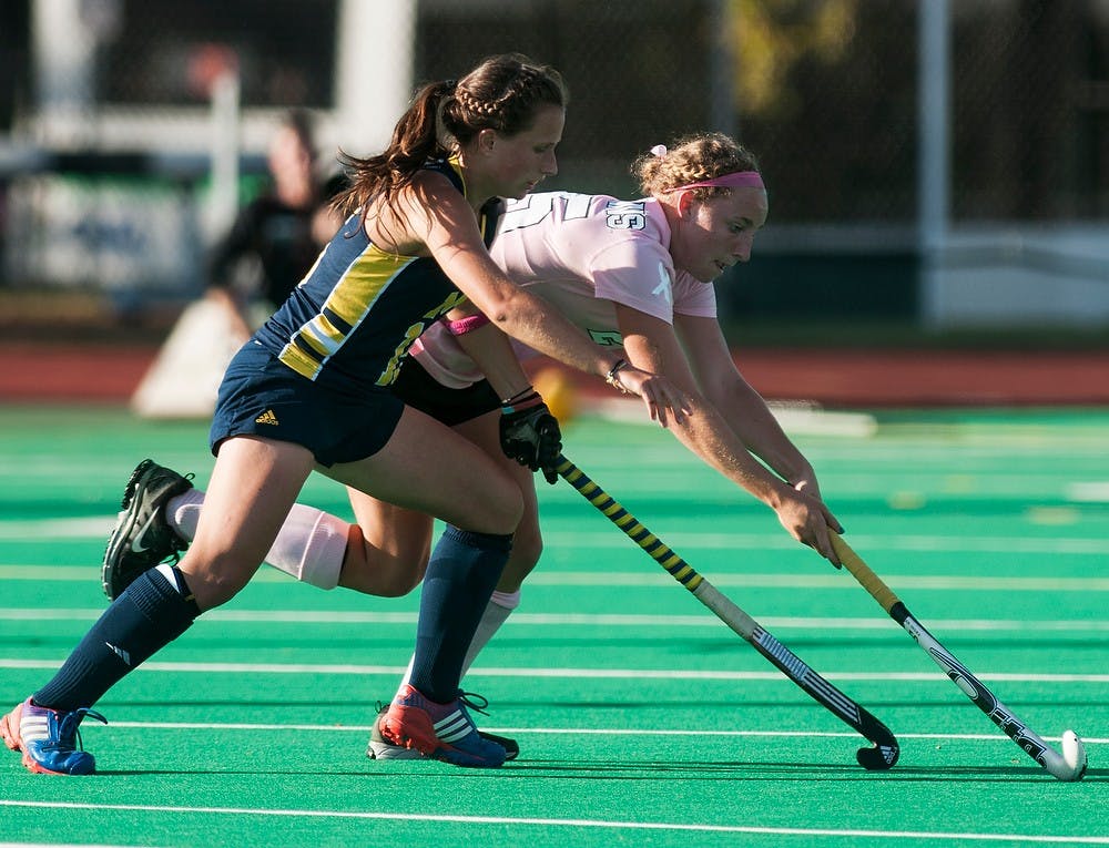 	<p>Freshman midfielder Kristin Matula tries to keep the ball from Michigan  back Lauren Thomas, Oct. 11, 2013, at Ralph Young Field. <span class="caps">MSU</span> defeated Michigan in double overtime, 3-2. Danyelle Morrow/The State News</p>