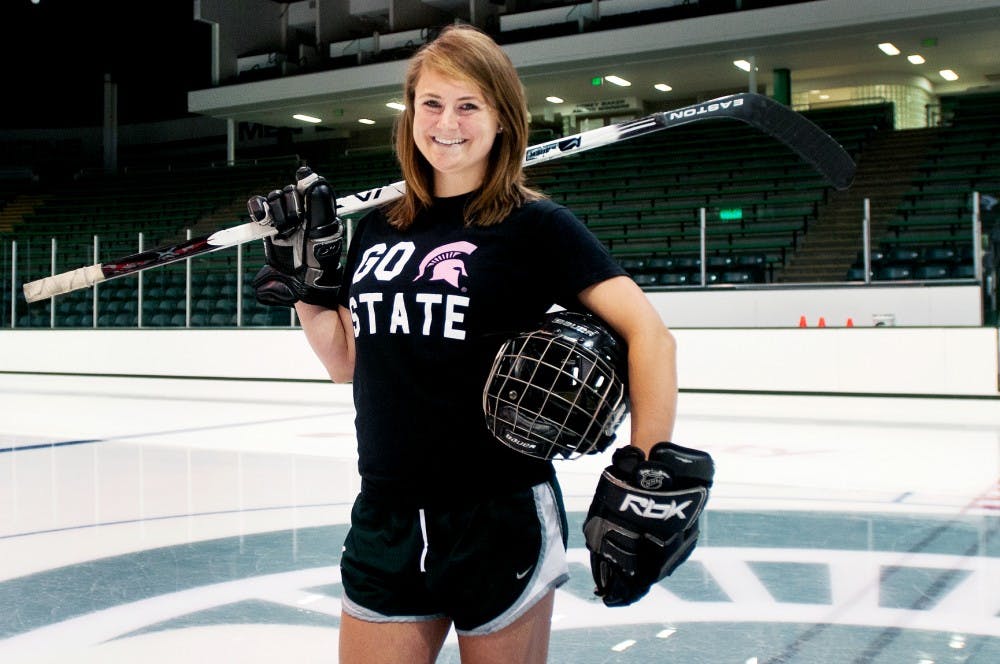 Kinesiology senior Sara Sherman stands out on the ice on Wednesday morning at Munn Ice Arena. The Vice President of the Varsity Women's Club Ice Hockey Team, who came back after suffering a traumatic brain injury in February 2010, is a member of the 2012 Homecoming Court. Samantha Radecki/The State News