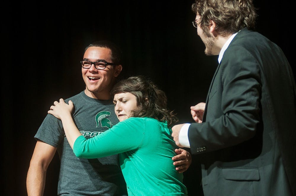 	<p>Athletic training freshman Anthony Alfredo is hugged by cast member Kelsey Kinney during a performance by The Second City, Oct. 2, 2013, in the <span class="caps">RCAH</span> Theater. Alfredo was pulled from the audience to participate in a short skit. Danyelle Morrow/The State News</p>
