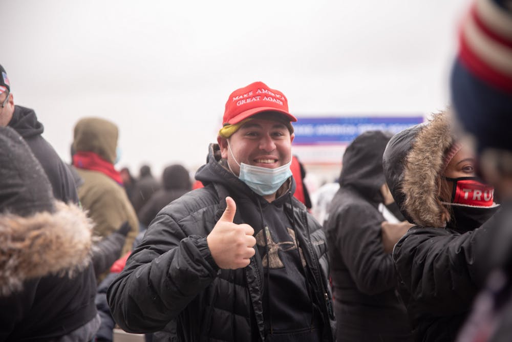 <p>A supporter of President Donald Trumps run for reelection giving a thumbs up at the Lansing, Michigan Trump 2020 Rally on Tuesday, October 27, 2020. </p>