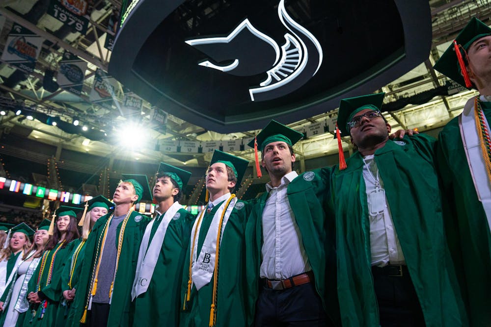 <p>Michigan State students embrace each other and sing the Michigan State Alma Mater song during a convocation in East Lansing, Mich., on May 1, 2026.</p>