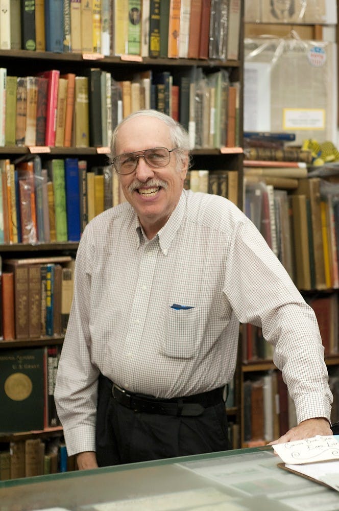 	<p>Owner of Curious Book Shop Ray Walsh poses for a portrait Oct. 3, 2013, behind the counter of the store. Walsh has been the owner of the book shop for more than 40 years. Margaux Forster/The State News</p>
