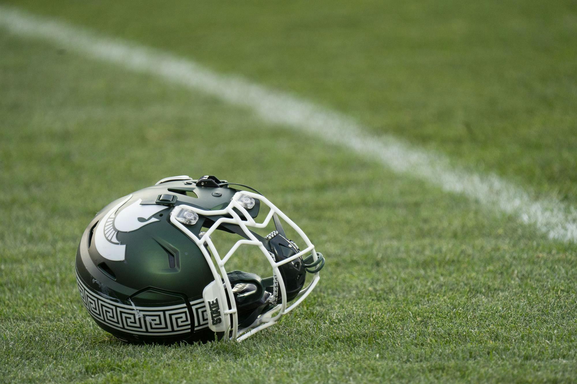 A Spartan helmet lies on the football field after MSU defeats Prairie View on Sept. 14, 2024.