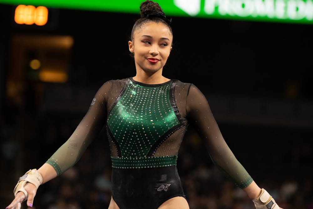 <p>Junior Lea Mitchell waits to begin her floor routine on Feb. 22, 2020 during Elevate the Stage at the Huntington Center in Toledo, OH. </p>