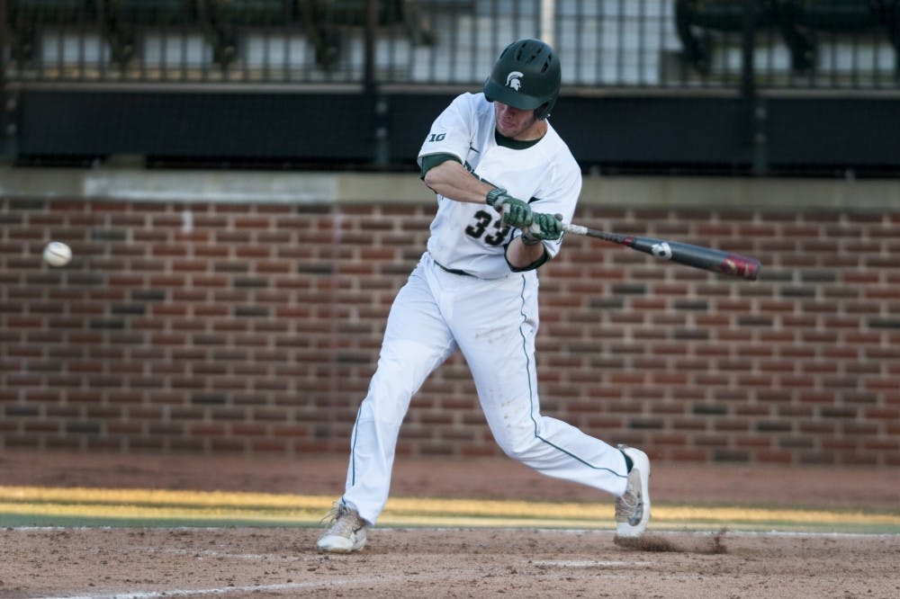 Junior outfielder Brandon Hughes (33) hits the ball during the game against Central Michigan on March 21, 2017 at McLane Stadium at Kobs Field. The Spartans defeated the Chippewas, 11-2.