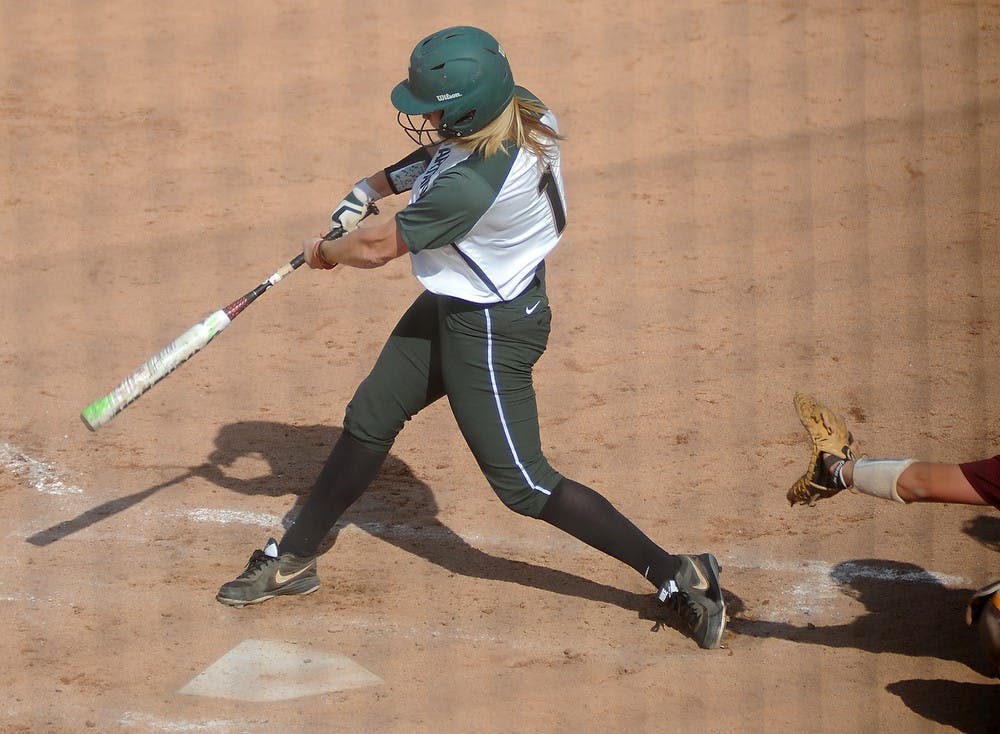 <p>Freshman outfielder Lea Foerster bats April 17, 2015, during a game against Minnesota at Secchia Softball Stadium. The Spartans were defeated by the Golden Gophers, 8-4. Alice Kole/The State News</p>