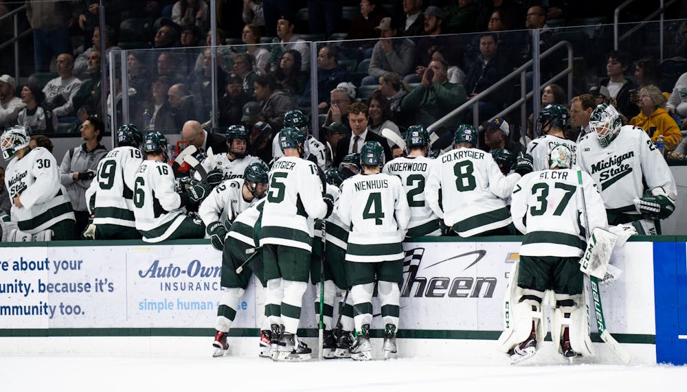 <p>The MSU men&#x27;s hockey players take a break and discuss their game plan during a game against the University of Michigan at Munn Ice Arena on Dec. 9, 2022. The Spartans defeated the Wolverines 2-1. </p>