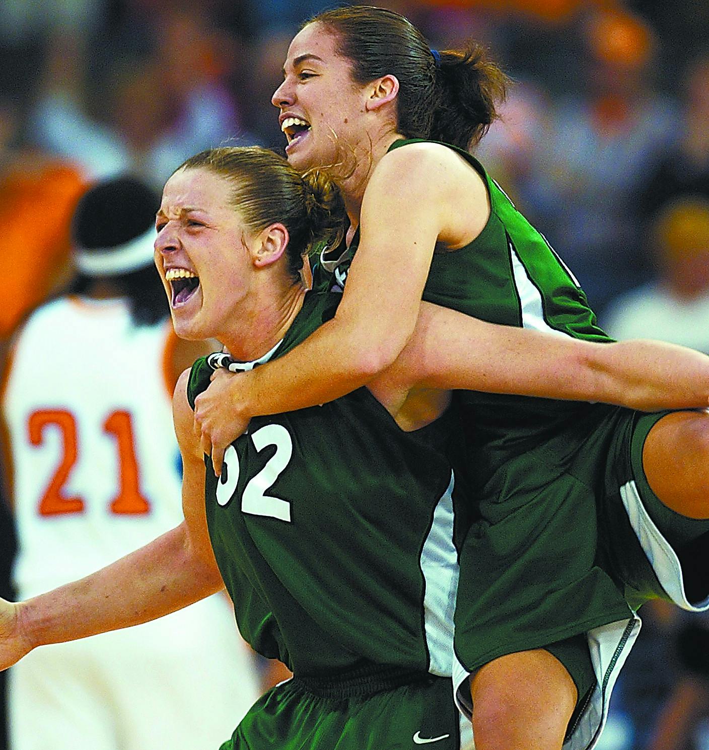 Michigan State's Liz Shimek (52) and Lindsay Bowen celebrate after beating Tennessee 68-64 in a national semifinal game at the NCAA Women's Final Four Sunday, April 3, 2005, in Indianapolis. (AP Photo/Ed Reinke)