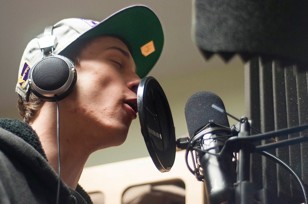 <p>Marketing freshman Dustyn Frolka raps in his dorm room March 18, 2013, in Emmons Hall. Frolka hoped to pursue a career in rapping. Julia Nagy/The State News</p>