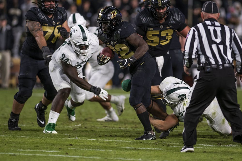 <p>Spartan freshman linebacker Cal Haladay (27) takes down Purdue running back King Doerue (22) in MSU&#x27;s match against the Boilermakers at Ross-Ade Stadium in West Lafayette on Saturday, Nov. 6, 2021.</p>