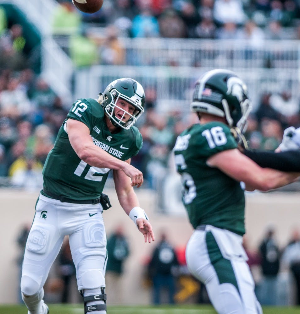 Redshirt freshman quarterback Rocky Lombardi (12) throws a pass downfield during the game against Purdue on Oct. 27, 2018 at Spartan Stadium. The Spartans lead the Boilermakers 13-6 at half.