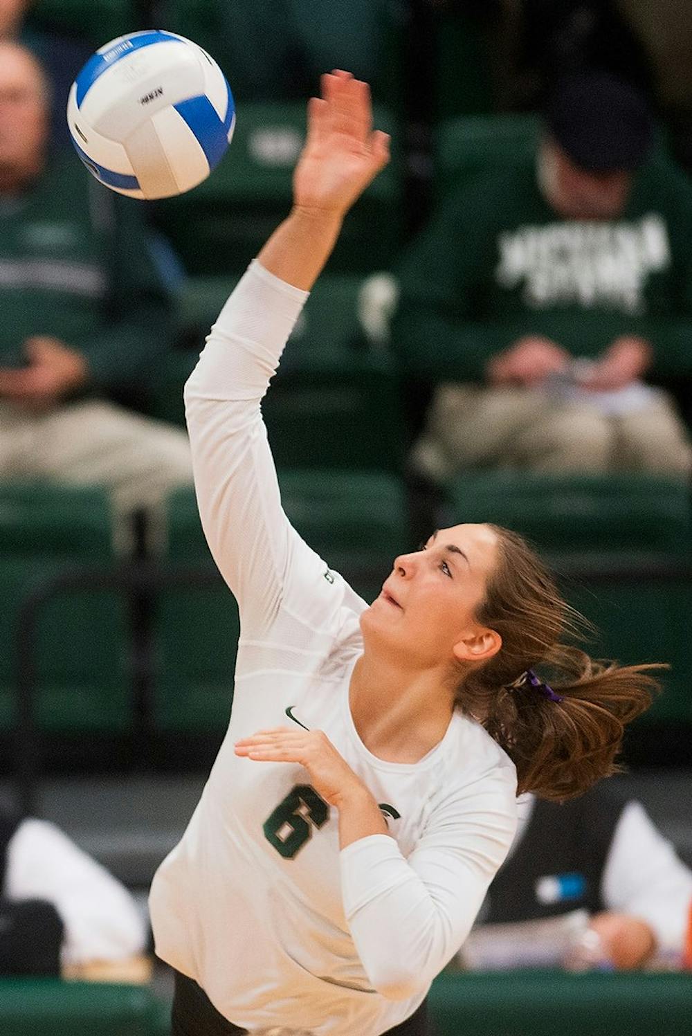 <p>Sophomore middle blocker Allyssah Fitterer spikes the ball on Oct. 31, 2014, at Jenison Field House during the game against Illinois. The Spartans lost, 3-1. Julia Nagy/The State News</p>