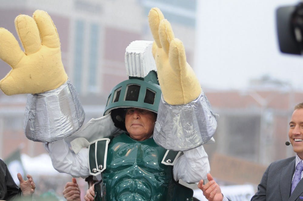 <p>Analyst Lee Corso donning his own Sparty outfit as he reveals his pick to win the match up between MSU and OSU for ESPN's College GameDay on Nov. 8, 2014, at Demonstration field. Dylan Vowell/The State News</p>