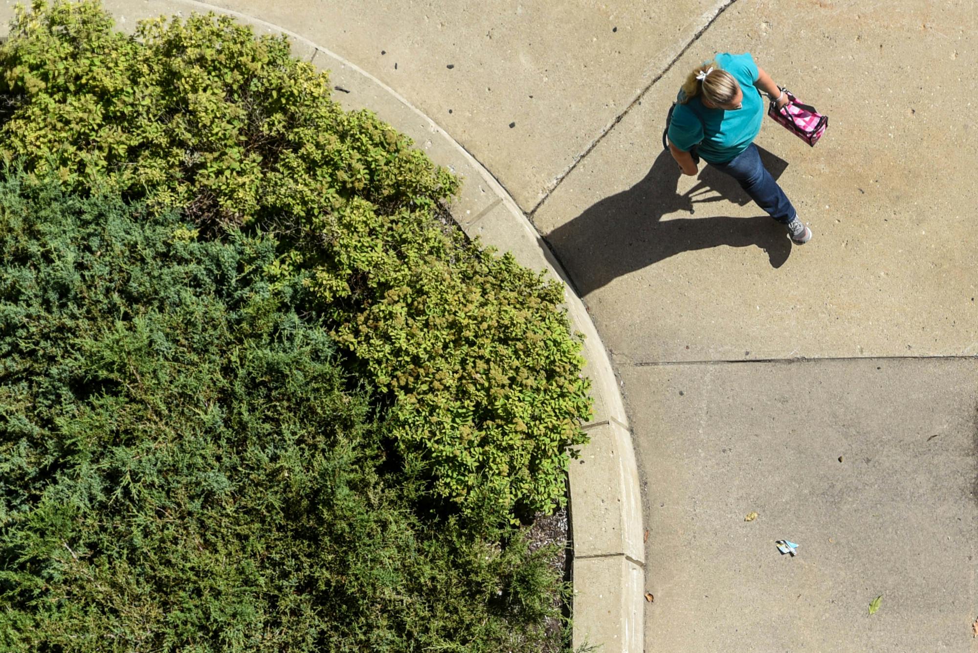 <p>A person walks on campus Aug. 11, 2020.</p>