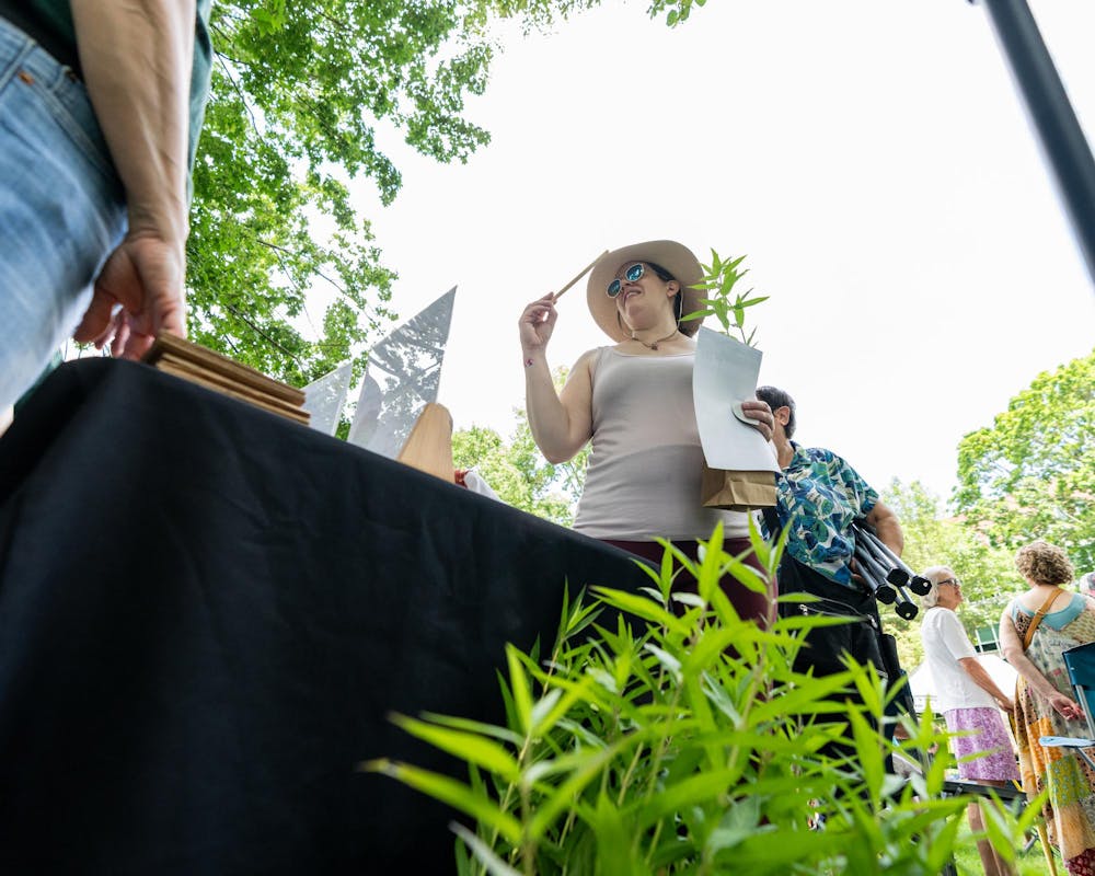 <p>Attendees of the Music and the Garden event are offered milkweed plants by Beal Botanical Garden volunteers in East Lansing, Mich., on June 28, 2026.</p>
