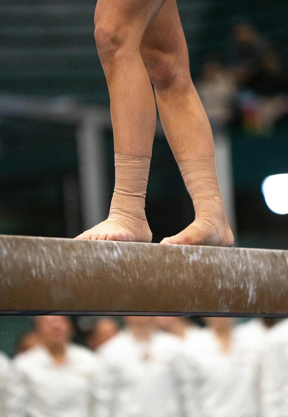 A gymnast on the bar during the MSU v WMU v UMD at Jenison Field House in East Lansing, on Feb. 15th, 2026.