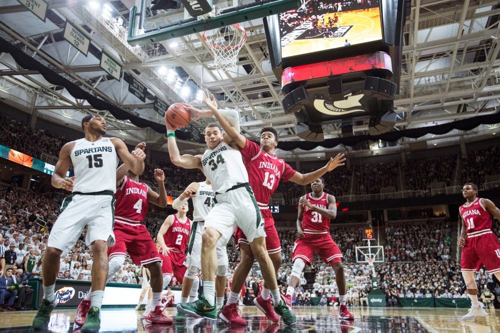Junior forward Gavin Schilling grabs a rebound while Indiana forward Juwan Morgan attempts to defend him during the second half of the game against Indiana on Feb.14, 2016 at Breslin Center. The Spartans defeated the Indiana Hoosiers, 88-69.