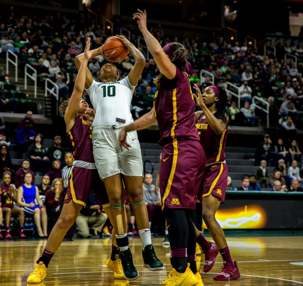 <p>Sophomore forward Sidney Cooks (10) fights to hold the ball during the first half of the game against Minnesota on Jan. 9, 2019 at Breslin Center. The Spartans lead the Gophers, 43-29 at halftime.</p>