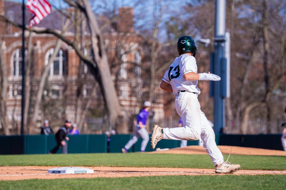 <p>Freshman infielder No. 13 Landen Lozier alertly rounds third base during the MSU baseball team’s home opener vs. the University of Evansville at McLane Baseball Stadium on March 15, 2024.</p>