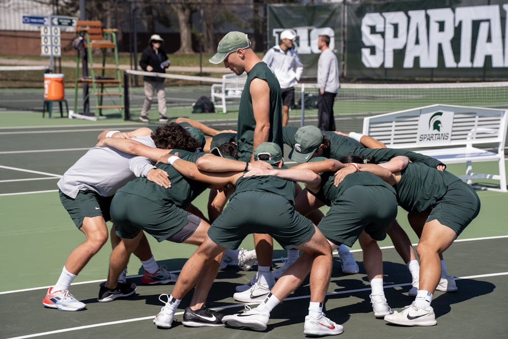 <p>MSU Men's Tennis huddles up before their match against PSU on April 9, 2023.</p>