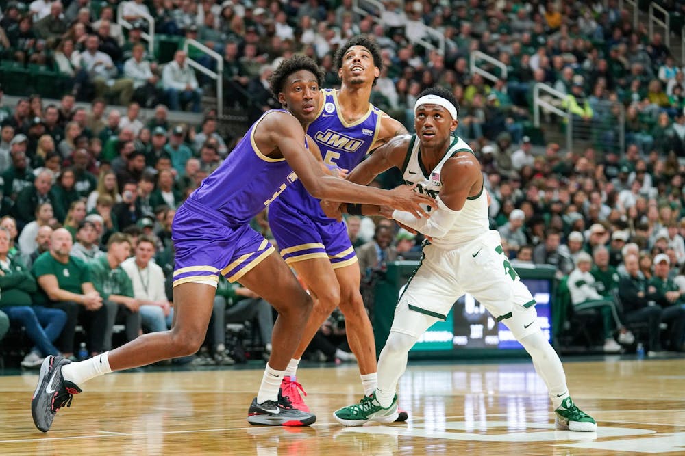 <p>Graduate student guard Tyson Walker (2) boxing out sophomore forward Jerell Roberson (33) during a game between Michigan State and James Madison University at the Breslin Student Events Center on Nov. 6, 2023.</p>