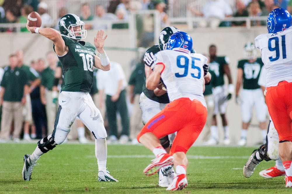 Junior quarterback Andrew Maxwell throws the football during the game against Boise State on Friday night, Aug. 31, 2012, at Spartan Stadium. This was Maxwell's first game as the starter quarterback.  Natalie Kolb/The State News