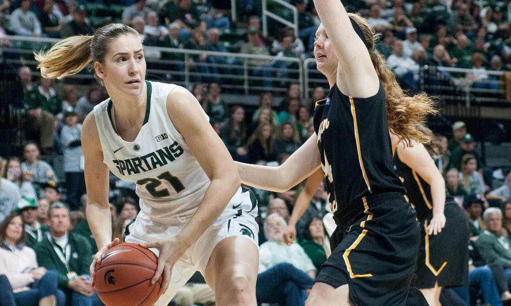 Freshman center Hana Vesela dribbles past Michigan Tech guard Sarah LewAllen during the second half of the women basketball game against Michigan Tech on Nov. 8, 2015 at Breslin Center. The Spartans defeated the Huskies, 74-43. 