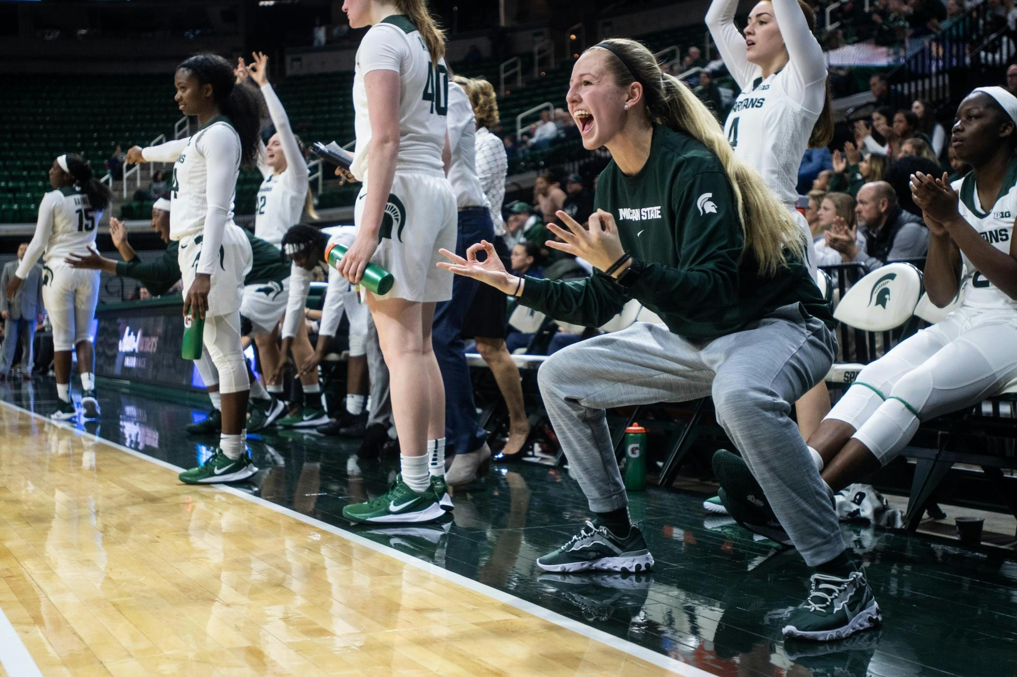 Redshirt sophomore Claire Hendrickson celebrates from the bench during the game against Eastern Michigan Nov. 5, 2019 at the Breslin Center.