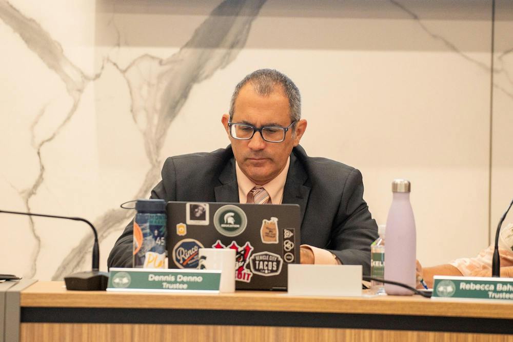 <p>MSU Trustee Dennis Denno looks at his computer during the MSU Board of Trustees meeting in East Lansing, Mich., on Sept. 11, 2026.</p>