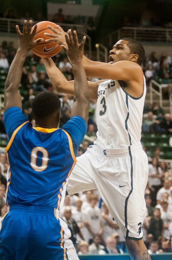 	<p>Freshman guard Alvin Ellis <span class="caps">III</span> goes up for a lay-up during the game against McNeese State on Nov. 8, 2013, at Breslin Center. The Spartans defeated the Cowboys, 98-56. Khoa Nguyen/The State News</p>