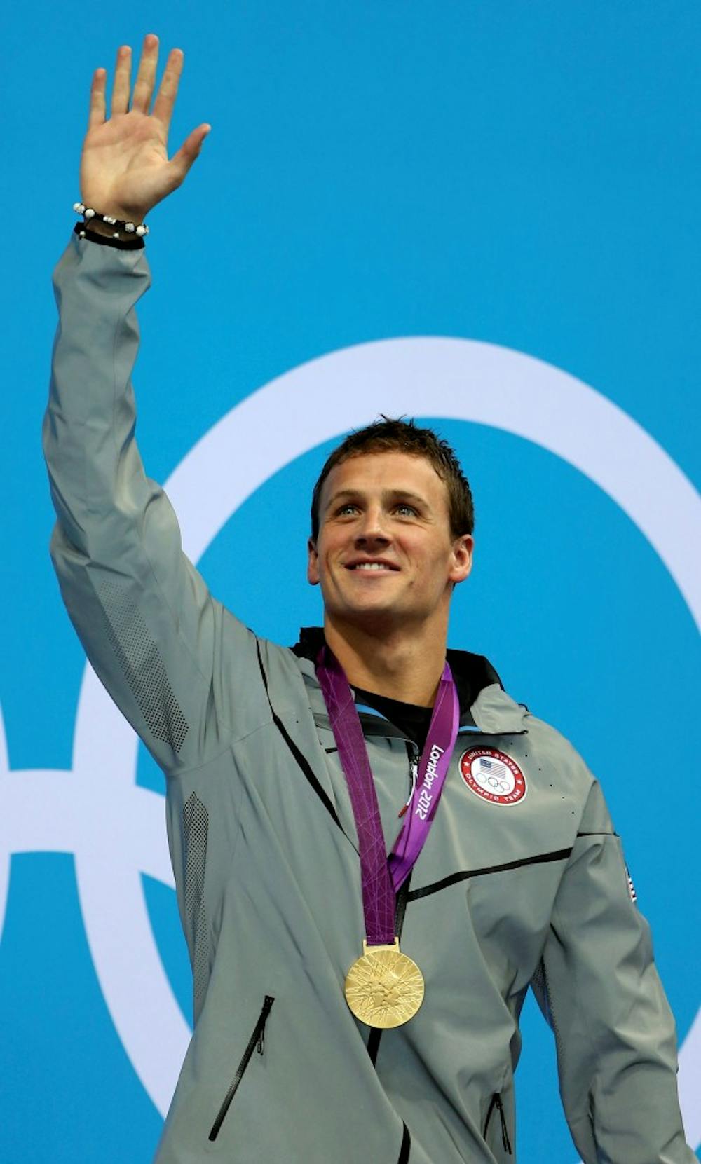 Ryan Lochte of the United States acknowledges the crowd after receiving his gold medal for winning the 400m Individual Medley during the 2012 Summer Olympics at the Aquatics Centre on Saturday, July 28, 2012 in London, England. (Vernon Bryant/Dallas Morning News/MCT)