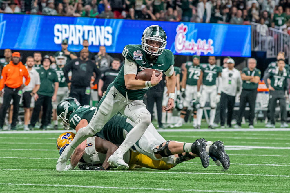 <p>Redshirt sophomore quarterback Payton Thorne scrambles downfield during the Spartans&#x27; 31-21 victory against Pitt in the Chick-Fil-A Peach Bowl on Dec. 30, 2021.</p>