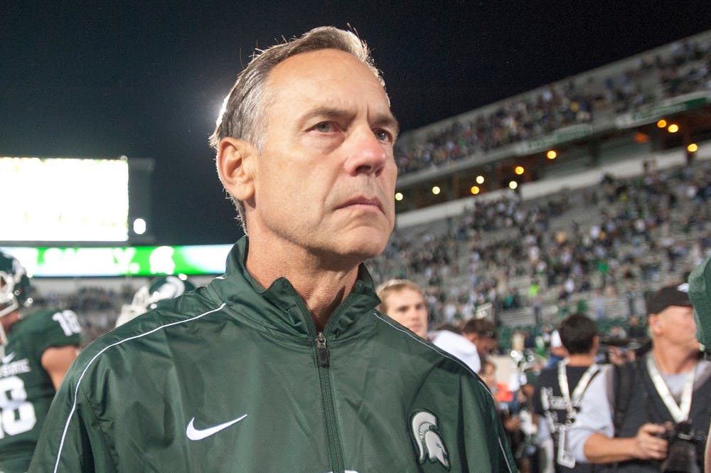 Head coach Mark Dantonio walks off the field after the Fighting Irish defeated the Spartans on Saturday, Sept. 15, 2012 at Spartan Stadium. Justin Wan/The State News