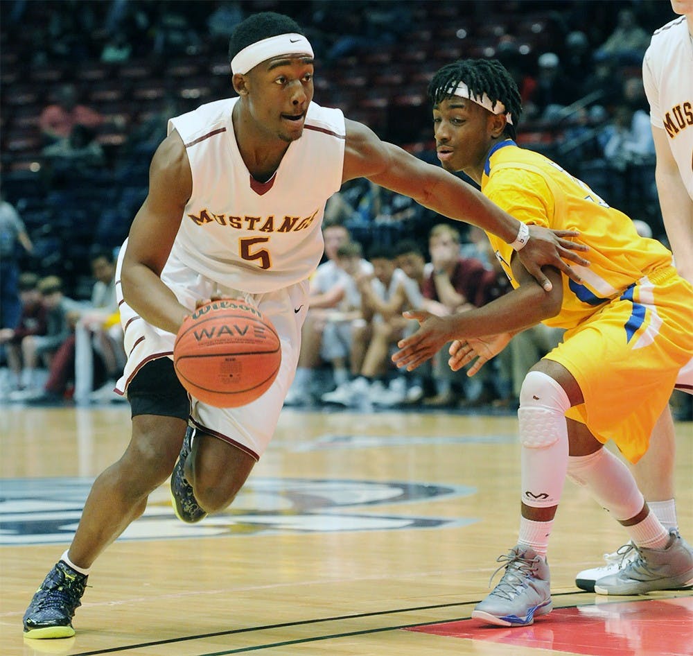 <p>Madison Academy’s Joshua Langford drives around Piedmont’s C.J. Savage during the AHSAA State Finals Class 3A championship game in Birmingham, Ala., Friday, Feb. 27, 2015. (Photo courtesy Mark Almond/al.com)</p>