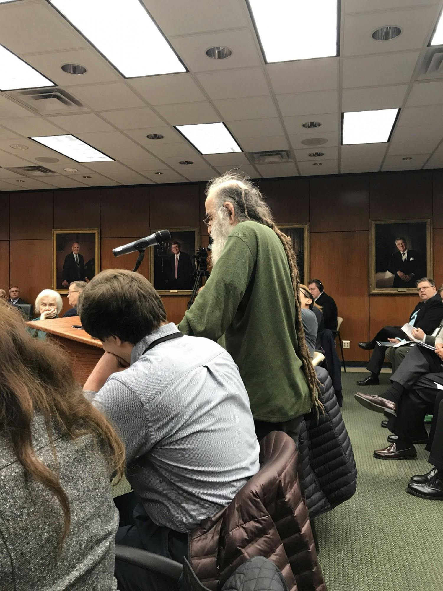 <p>Former professor Selman Akbulut pictured at a Board of Trustees meeting in October 2018. </p>