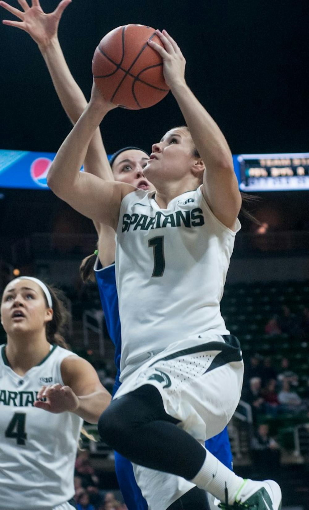 <p>Sophomore guard Tori Jankoska goes for a layup during the game against Grand Valley State on Nov. 9, 2014, at the Breslin Center. The Spartans defeat the Lakers 70-51. Raymond Williams/The State News</p>