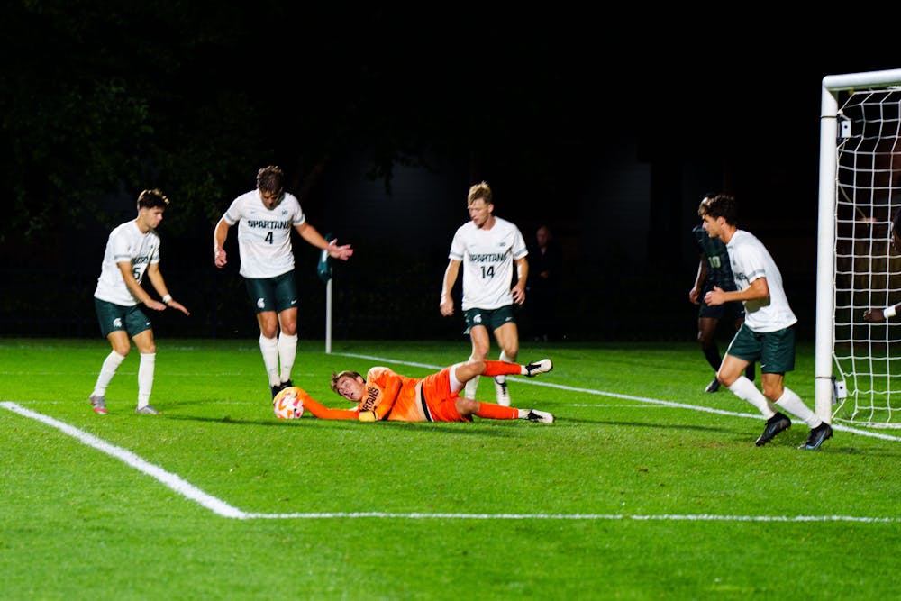 <p>Senior goalkeeper Owen Finnerty (1) makes a save in an MSU and Chicago State University men's soccer game at DeMartin Field on Sept. 12, 2022. The Spartans defeated the Cougars 4-1.</p>
